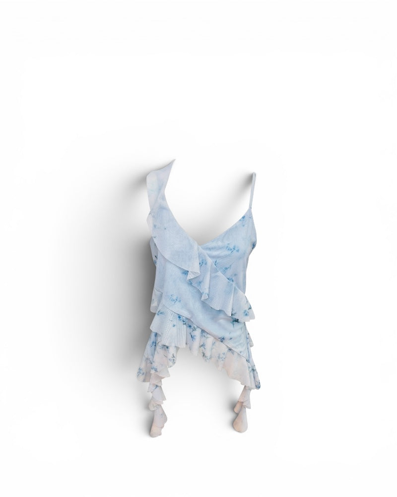 Jersey fluido azul efecto tie-dye con volante asimétrico.